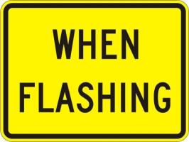 W16-13 - When Flashing Sign