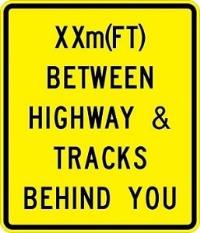 W10-11b - Between Highway And Tracks Sign