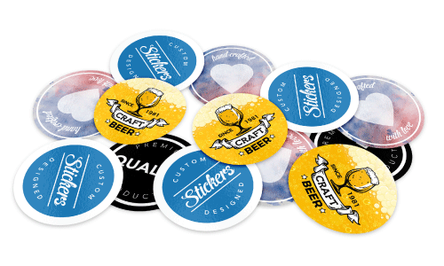 A pile of blue and yellow custom stickers featuring a craft beer logo.