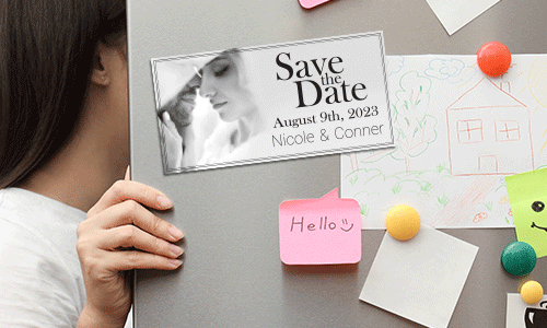 A Save the Date Magnet on a fridge featuring a couple in black and white the wedding date and the names Nicole and Conor.