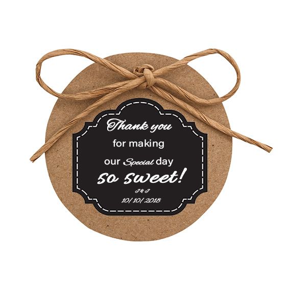 Wedding label on a wooden wedding favor with a leather bow on top.