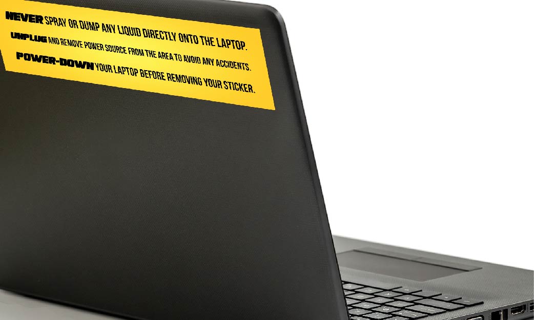 yellow laptop sticker on black laptop