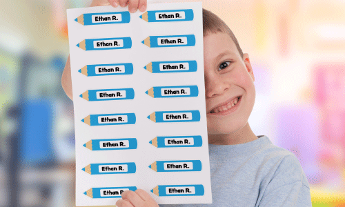 Little boy holding custom pencil label sheet