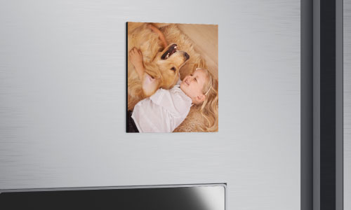 photo fridge magnet of little girl and a golden retriever