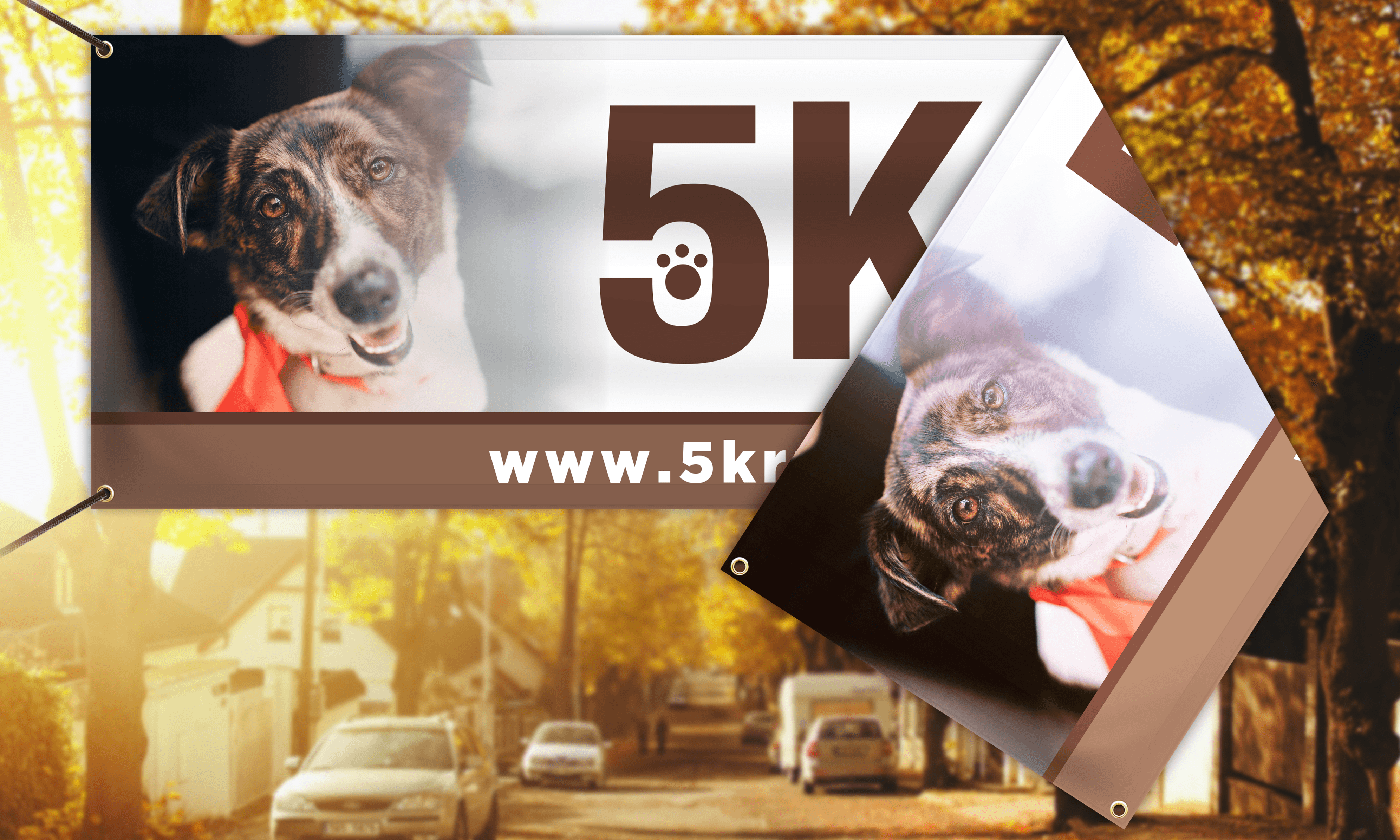 City street scene with double sided vinyl banner for a 5k marathon. The banner features a brown and white dog in an orange collar.