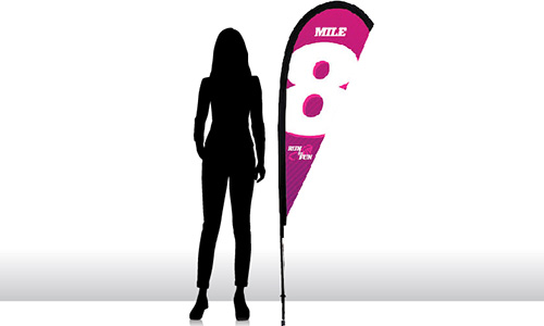 6 foot tear drop flag next to the silhouette of a woman.